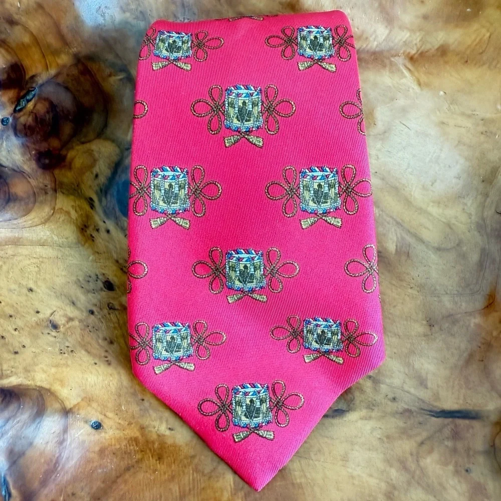 Vintage Hermès red silk tie with a repeating drum motif 3.5” x 54”